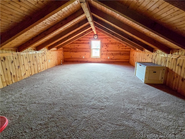 bonus room with wood walls, carpet, vaulted ceiling with beams, and wooden ceiling