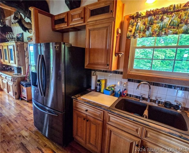 27271 Little Buffalo Rd, Stover, MO 65078 - kitchen with decorative backsplash, a sink, stainless steel fridge, dark wood-type flooring, and brown cabinetry