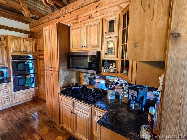 27271 Little Buffalo Rd, Stover, MO 65078 - kitchen featuring double oven, stainless steel microwave, glass insert cabinets, dark wood-style flooring, and black gas cooktop