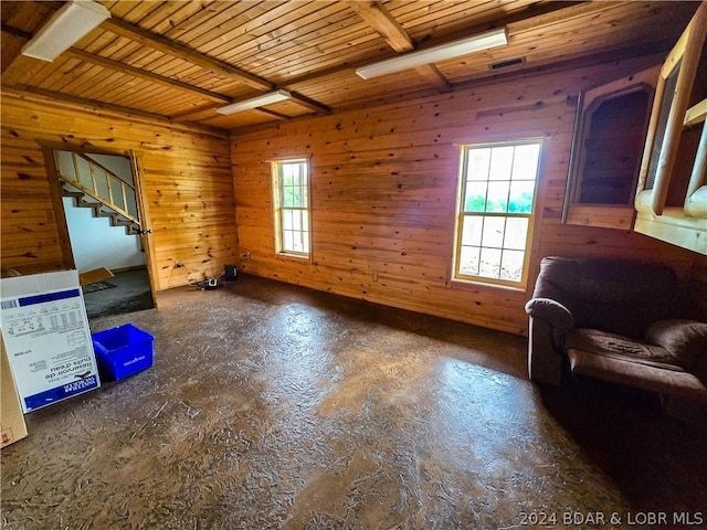 27271 Little Buffalo Rd, Stover, MO 65078 - living room featuring wood ceiling, wood walls, beam ceiling, concrete flooring, and stairs