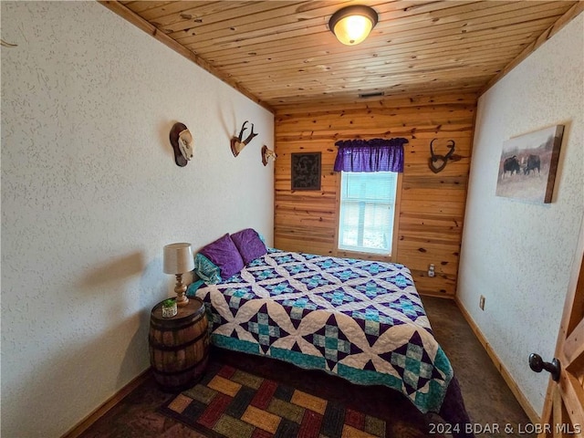 27271 Little Buffalo Rd, Stover, MO 65078 - bedroom featuring wooden walls, a textured wall, baseboards, wood ceiling, and carpet floors