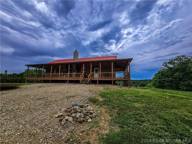 27271 Little Buffalo Rd, Stover, MO 65078 - rear view of property featuring a chimney, a porch, and metal roof
