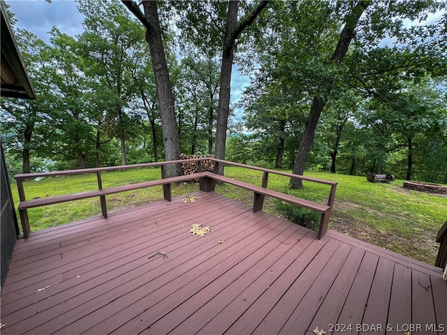 wooden deck with a yard