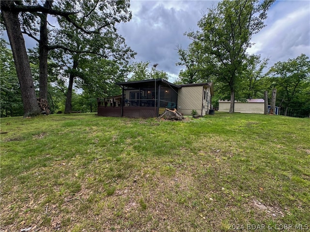 view of yard featuring a sunroom