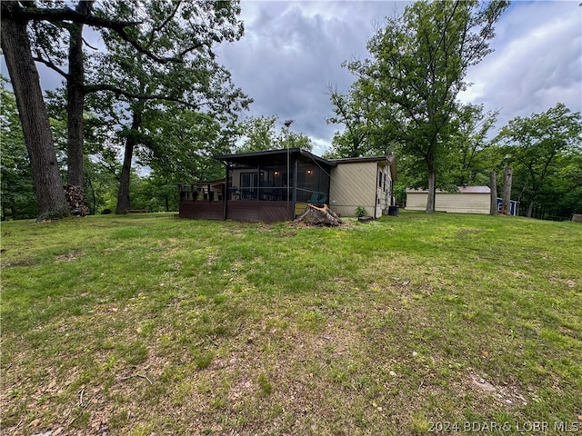 view of yard with a sunroom