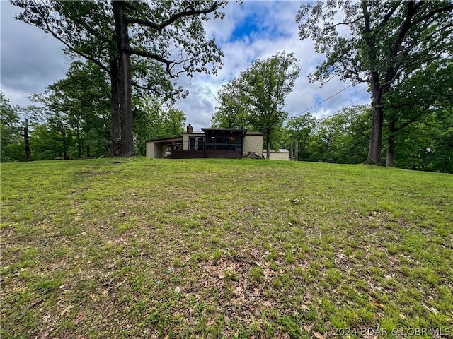 view of yard with a sunroom