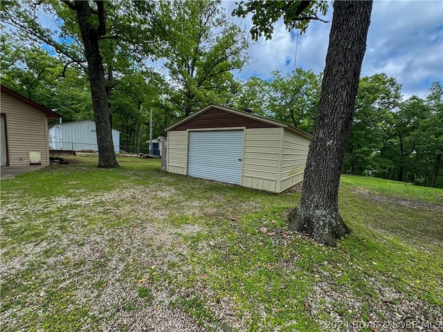 garage with a lawn