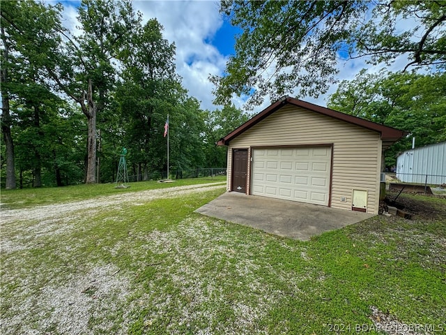 garage with a yard