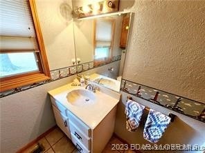 bathroom featuring tile patterned floors and vanity