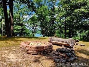 view of yard with a fire pit