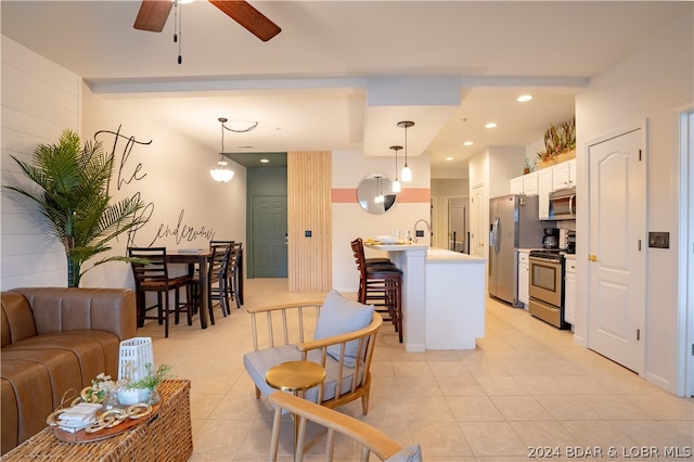 tiled living room with ceiling fan