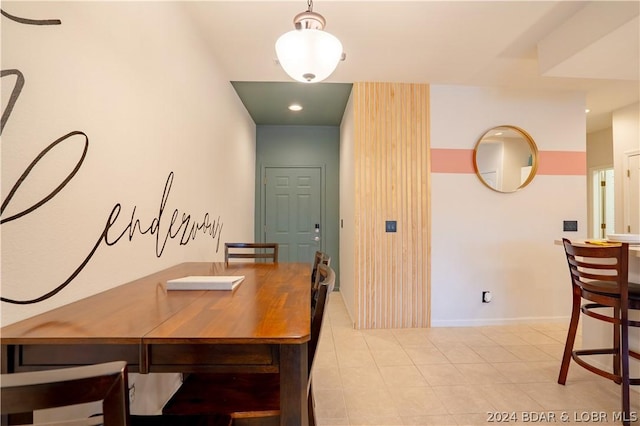 dining space with light tile patterned floors