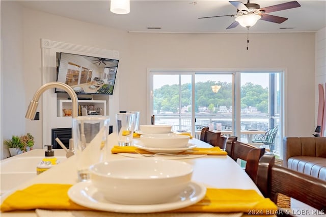 dining room featuring ceiling fan