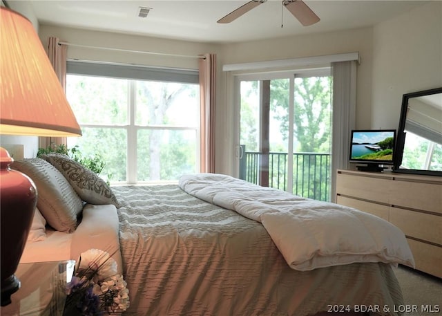 bedroom featuring ceiling fan and access to outside