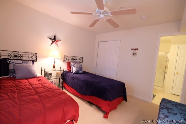 bedroom featuring carpet floors, ceiling fan, baseboards, and a closet