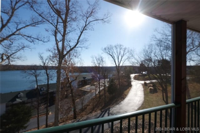 balcony featuring a water view