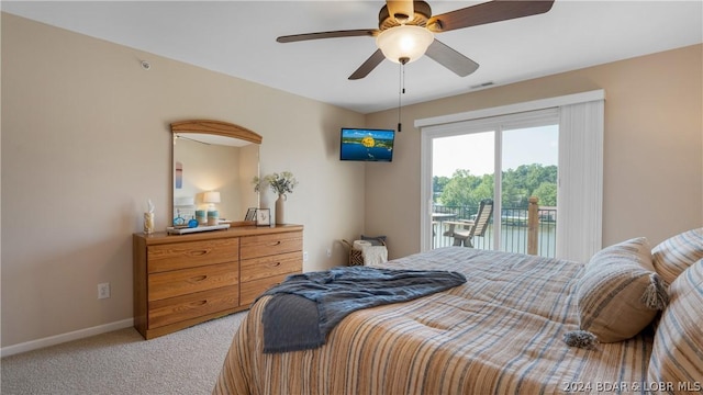 carpeted bedroom with ceiling fan and access to exterior