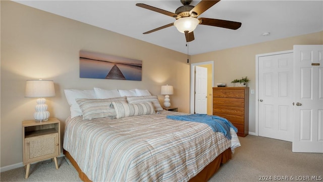 carpeted bedroom with ceiling fan