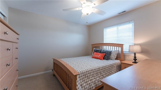 bedroom with light colored carpet and ceiling fan