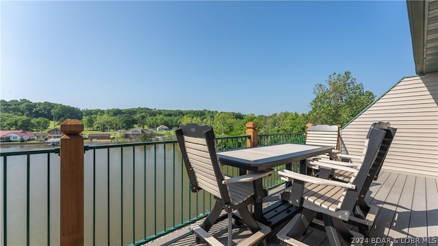 balcony featuring a water view