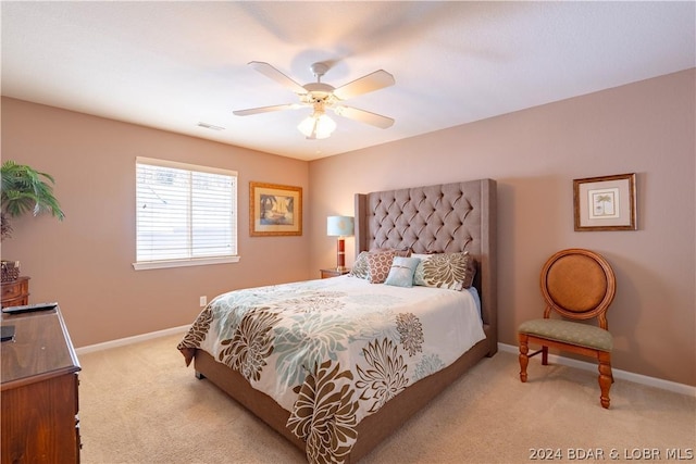 carpeted bedroom with ceiling fan