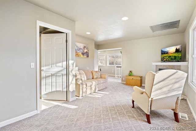 living area featuring light colored carpet