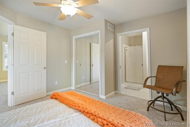 carpeted bedroom featuring a closet and ceiling fan