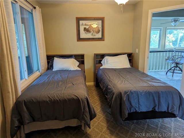 bedroom featuring dark colored carpet