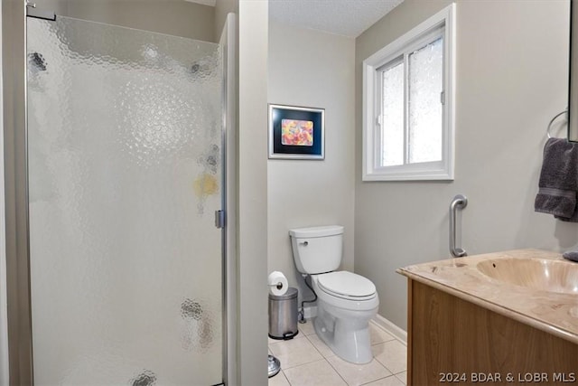 bathroom with toilet, tile patterned floors, walk in shower, and vanity