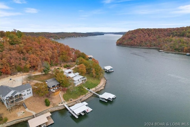 birds eye view of property featuring a water view