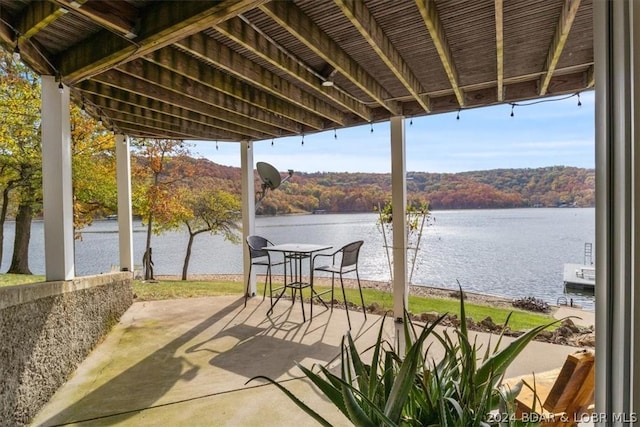 view of patio featuring a water view