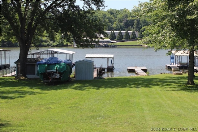 view of dock featuring a water view and a lawn