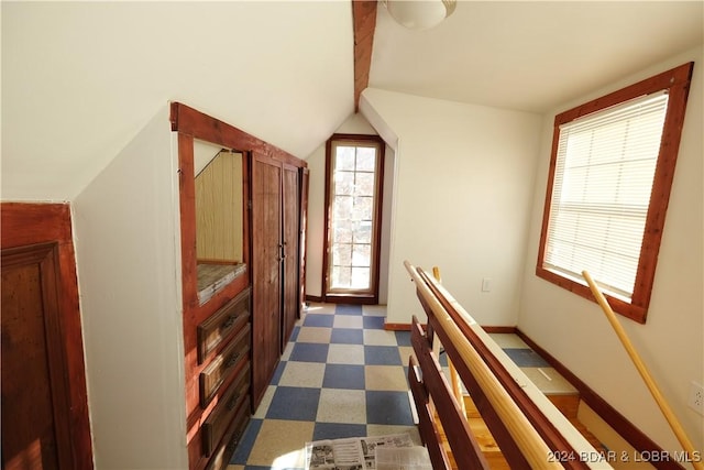 corridor with lofted ceiling