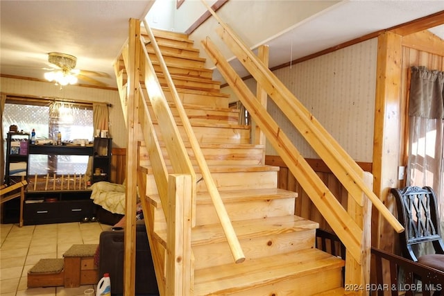 stairs with tile patterned floors and ceiling fan