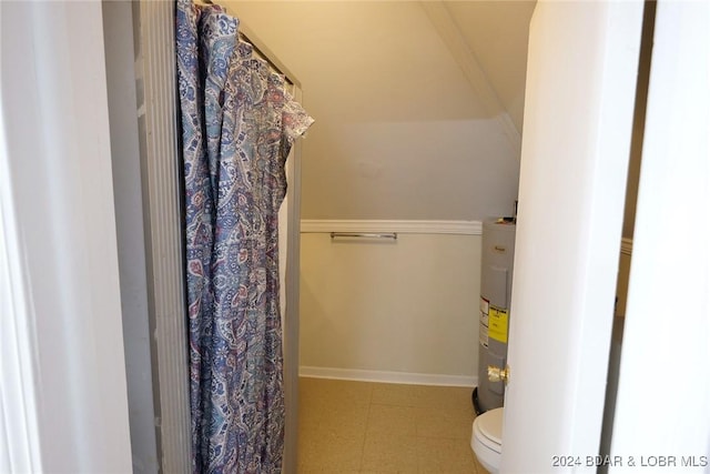 bathroom featuring toilet and water heater