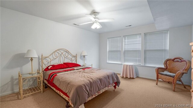 bedroom with ceiling fan and carpet flooring