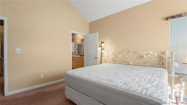 bedroom with lofted ceiling and carpet