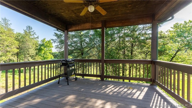 wooden deck featuring ceiling fan