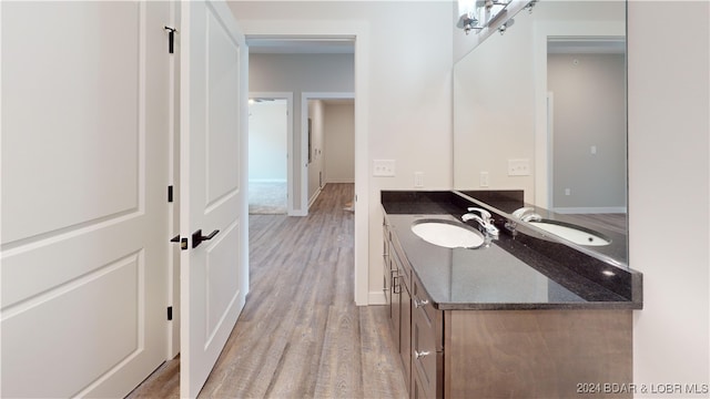 bathroom featuring vanity and hardwood / wood-style floors