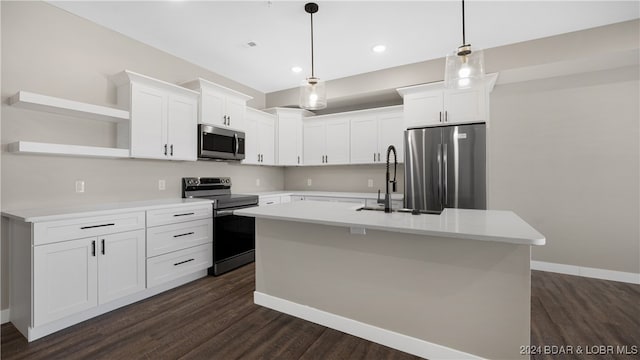 kitchen with a center island with sink, dark hardwood / wood-style flooring, stainless steel appliances, and white cabinets