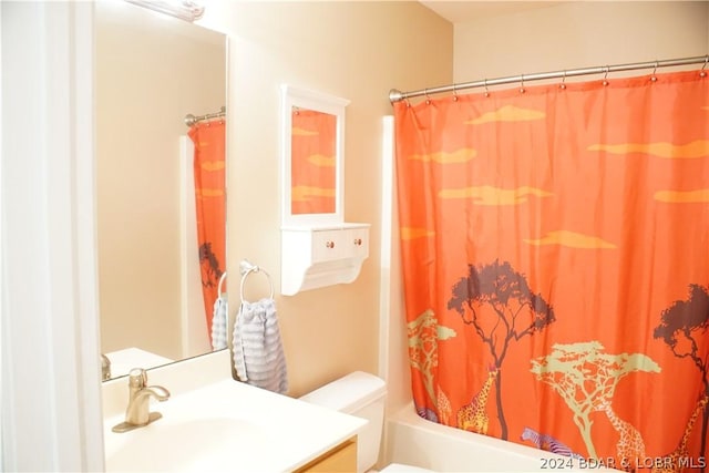 full bathroom with vanity, toilet, and shower / tub combo with curtain