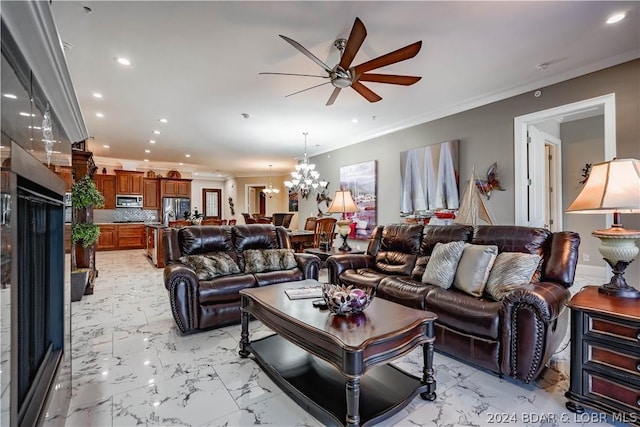 living room with ceiling fan with notable chandelier and ornamental molding