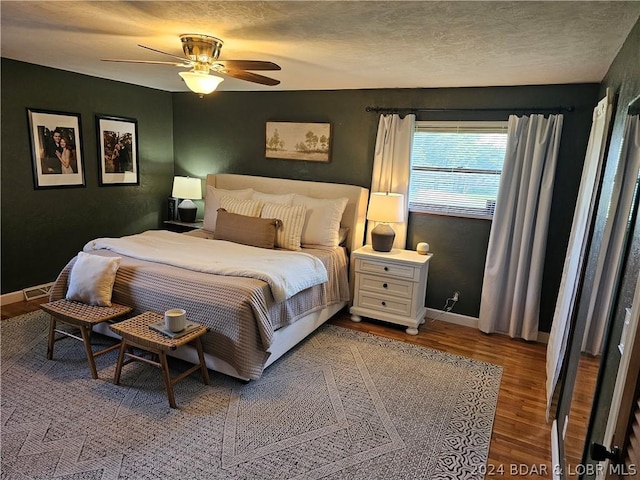 bedroom featuring ceiling fan and hardwood / wood-style floors