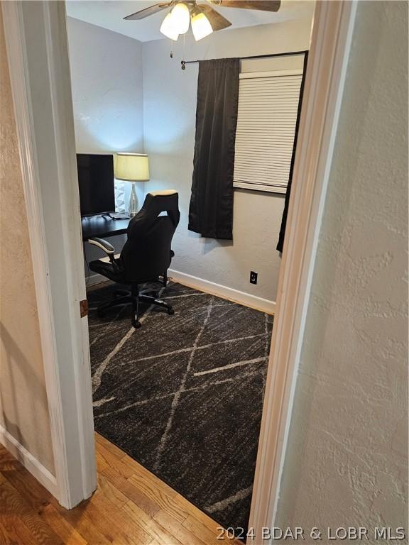 office area with ceiling fan and wood-type flooring