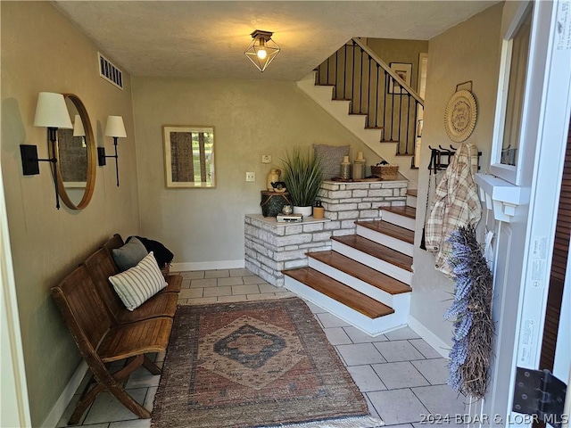 foyer entrance featuring tile patterned flooring