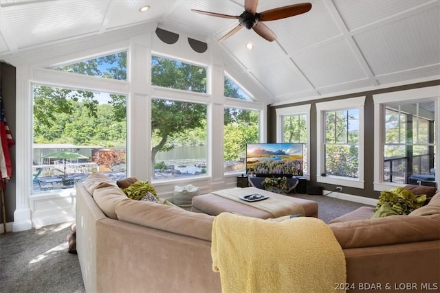 sunroom featuring lofted ceiling, ceiling fan, and plenty of natural light