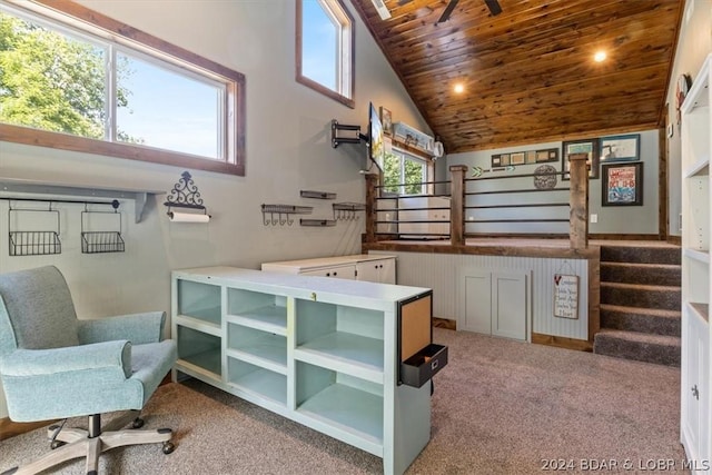 carpeted office space featuring wood ceiling and high vaulted ceiling