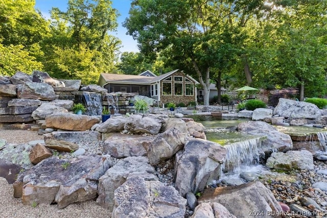 view of yard featuring a sunroom