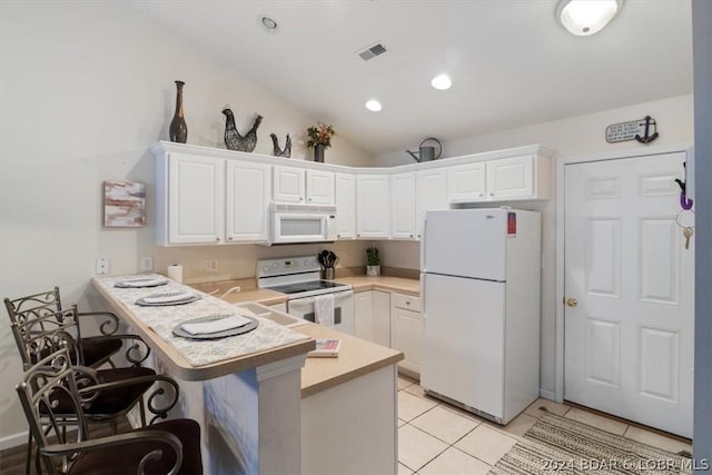 kitchen with white cabinetry, white appliances, and kitchen peninsula