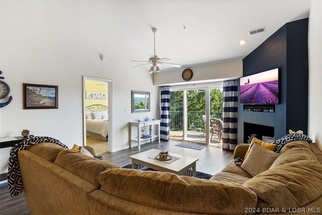 living room with hardwood / wood-style floors and ceiling fan